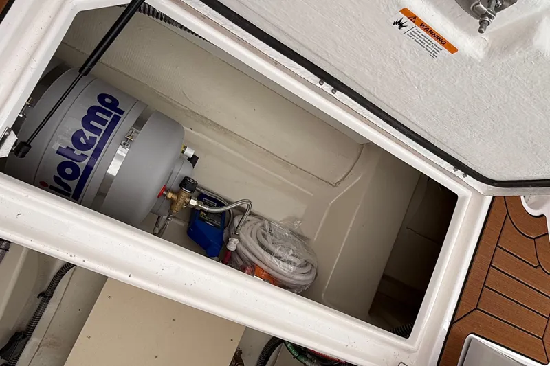  Yacht Photos Pics Storage compartment of 2025 Ranger Tugs R-25 with Isotemp water heater.