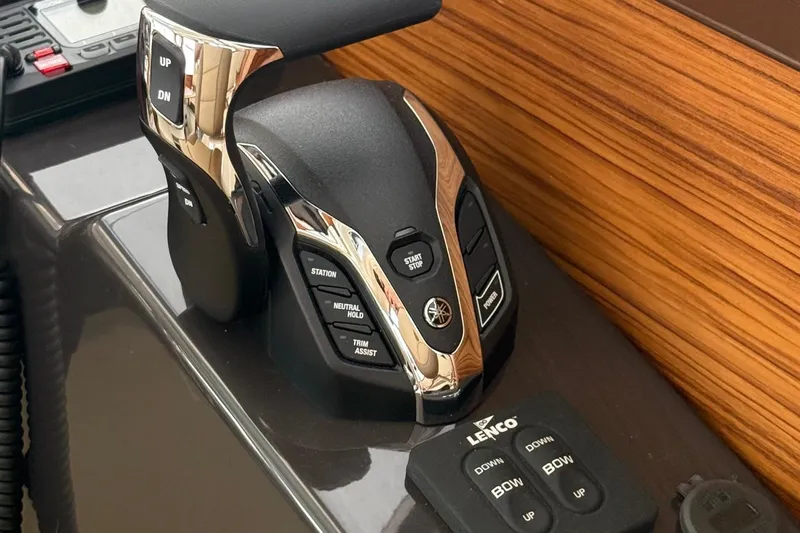  Yacht Photos Pics Control panel of 2025 Ranger Tugs R-25 boat with modern throttle and trim controls.