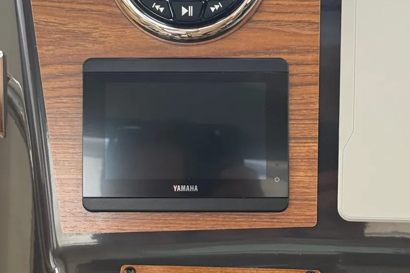  Yacht Photos Pics Yamaha display on 2025 Ranger Tugs R-25 dashboard with wood paneling.
