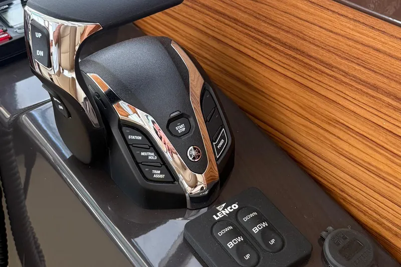  Yacht Photos Pics Control panel of 2025 Ranger Tugs R-25 boat with Yamaha throttle and Lenco trim tabs.