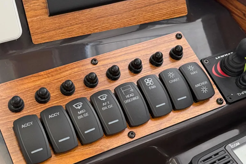  Yacht Photos Pics Control panel of 2025 Ranger Tugs R-25 boat with labeled switches and joystick.