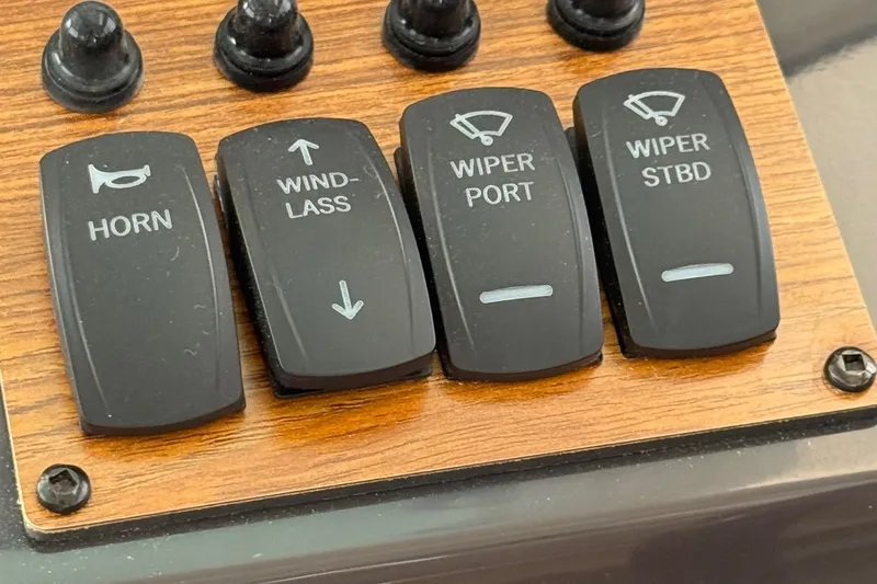  Yacht Photos Pics Control panel of 2025 Ranger Tugs R-25 with horn, windlass, and wiper switches.