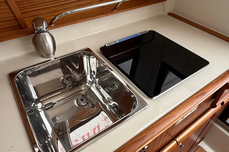  Yacht Photos Pics 2025 Ranger Tugs R-25 kitchen with stainless steel sink and modern cooktop.