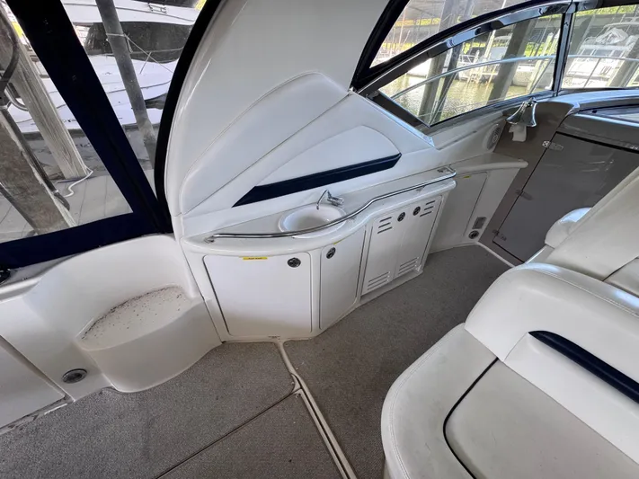 Skeeter Yacht Photos Pics 2004 Sea Ray 420 Sundancer interior with sleek white seating and cabinetry.
