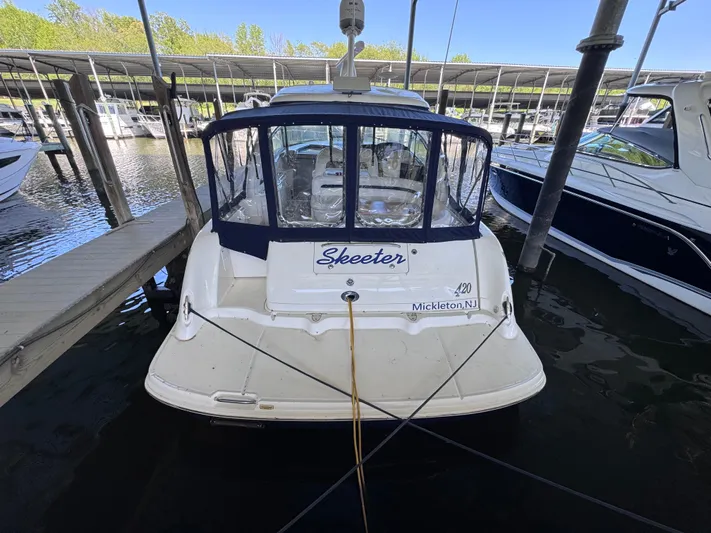 Skeeter Yacht Photos Pics 2004 Sea Ray 420 Sundancer docked at marina, rear view.