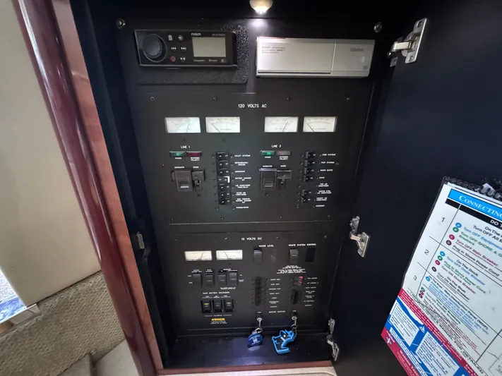 Skeeter Yacht Photos Pics Electrical panel inside 2004 Sea Ray 420 Sundancer yacht, showcasing control switches and meters.