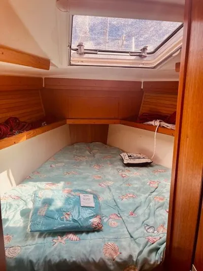 Sail N By Yacht Photos Pics Cozy cabin interior of 2001 Catalina 400 MkII sailboat with nautical-themed bedding.