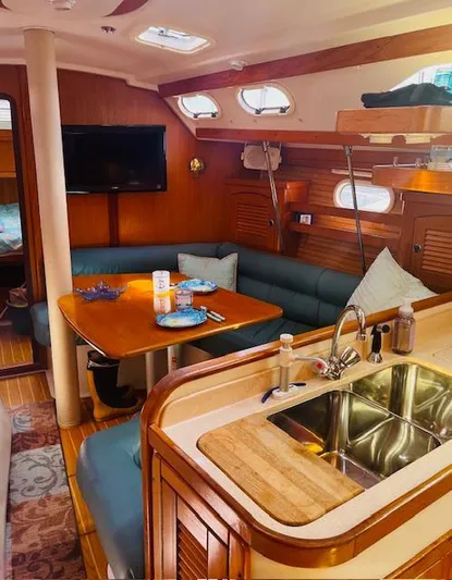 Sail N By Yacht Photos Pics Interior of 2001 Catalina 400 MkII sailboat with cozy seating and kitchen area.
