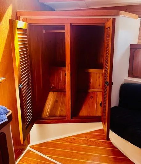 Sail N By Yacht Photos Pics Wooden interior of 2001 Catalina 400 MkII sailboat with open storage cabinets.