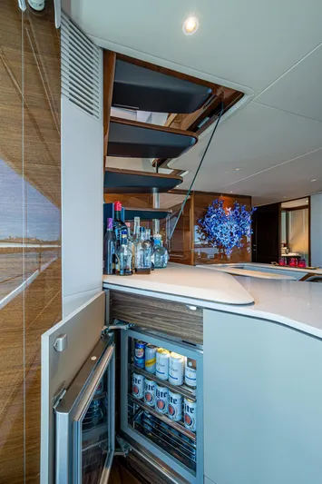  Yacht Photos Pics Luxurious 2022 Princess X95 yacht interior with modern bar and staircase.