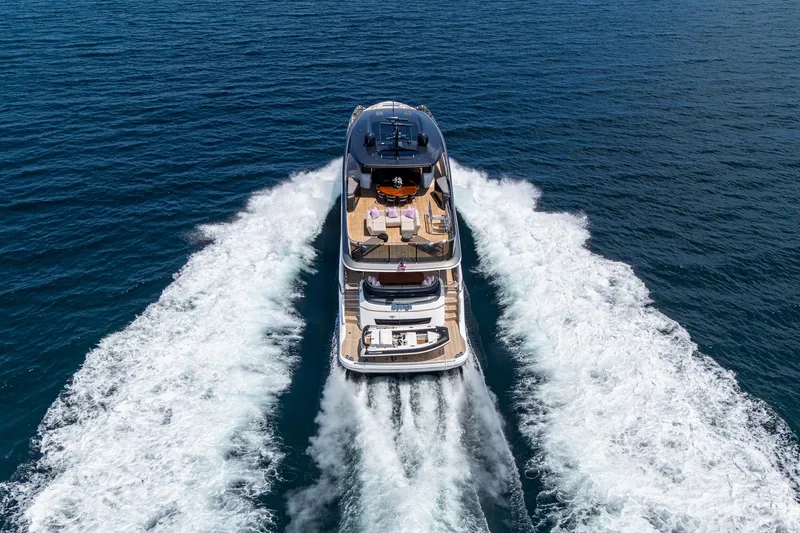  Yacht Photos Pics 2022 Princess X95 yacht cruising on open sea, leaving a wake behind.