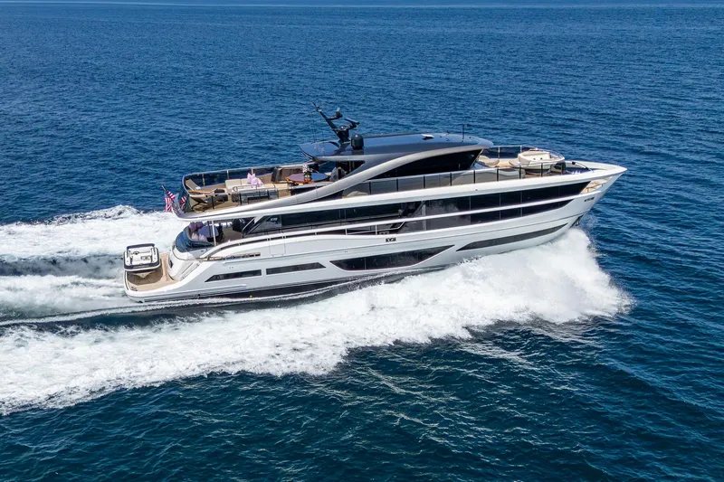  Yacht Photos Pics Luxurious 2022 Princess X95 yacht cruising on open sea, showcasing sleek design and elegance.