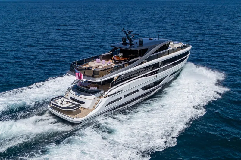  Yacht Photos Pics Luxury 2022 Princess X95 yacht cruising on open sea, showcasing sleek design and spacious decks.