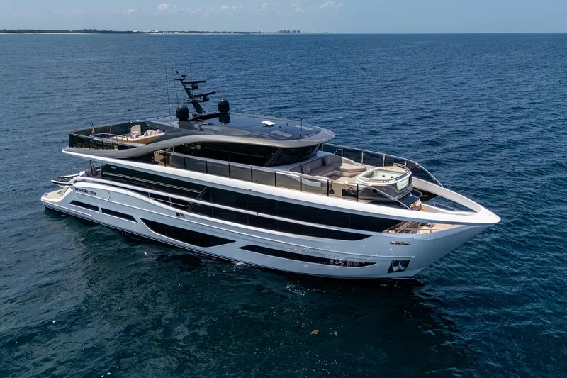 Yacht Photos Pics Luxurious 2022 Princess X95 yacht cruising on open sea, showcasing sleek design and spacious decks.