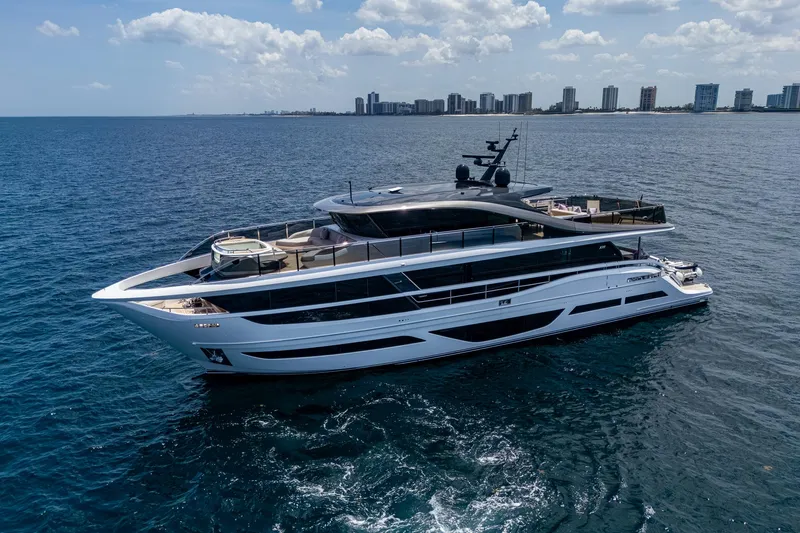 Yacht Photos Pics Luxurious 2022 Princess X95 yacht cruising on open sea near city skyline.