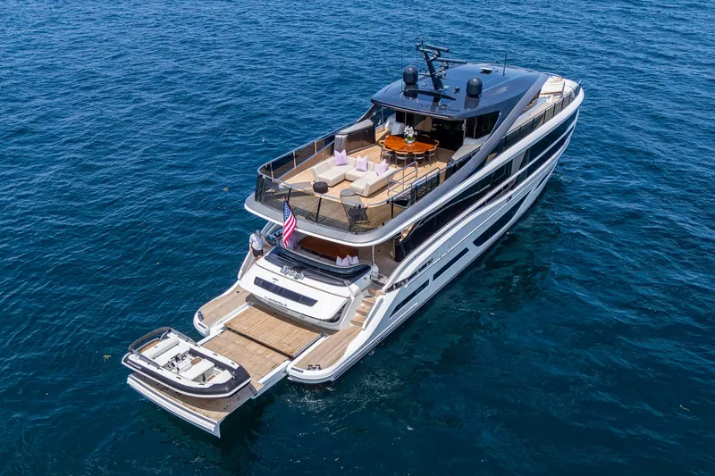  Yacht Photos Pics Luxurious 2022 Princess X95 yacht cruising on open water, showcasing elegant design and spacious decks.