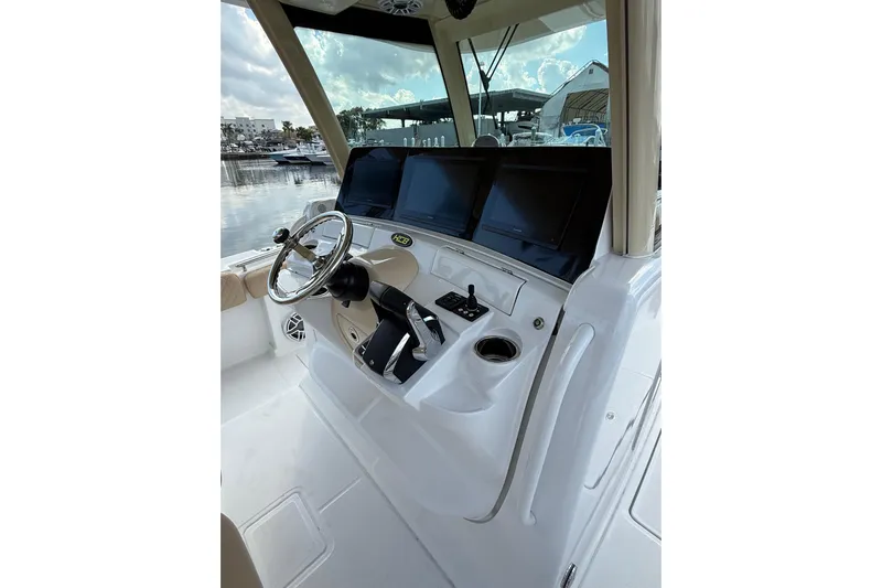 Sprinkles Yacht Photos Pics 2024 HCB 39 Speciale boat helm with modern controls and navigation screens.