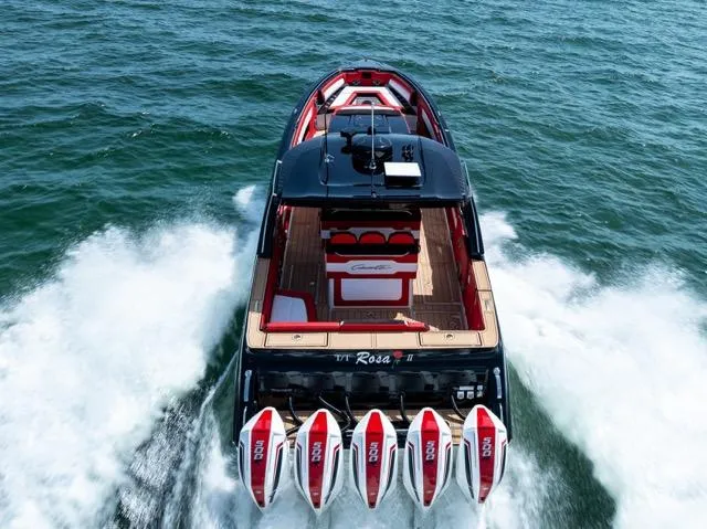  Yacht Photos Pics 2025 Cigarette 42 Auroris speedboat with five engines cruising on open water.