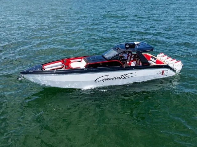  Yacht Photos Pics 2025 Cigarette 42 Auroris speedboat cruising on open water.