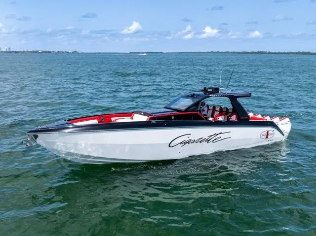 Yacht Photos Pics 2025 Cigarette 42 Auroris boat cruising on open water under a clear sky.