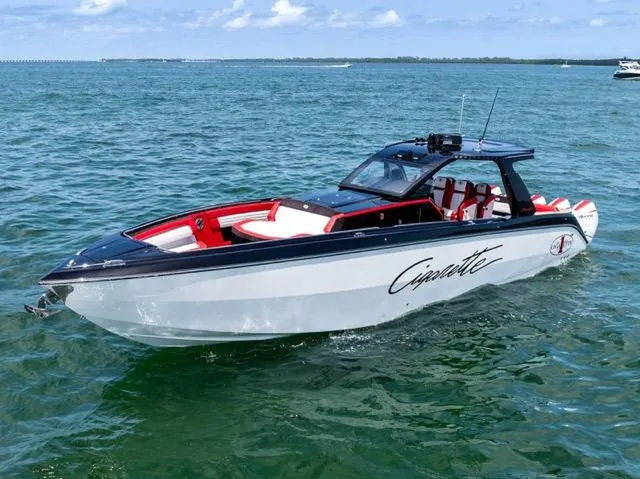  Yacht Photos Pics 2025 Cigarette 42 Auroris boat on open water, featuring sleek design and red accents.