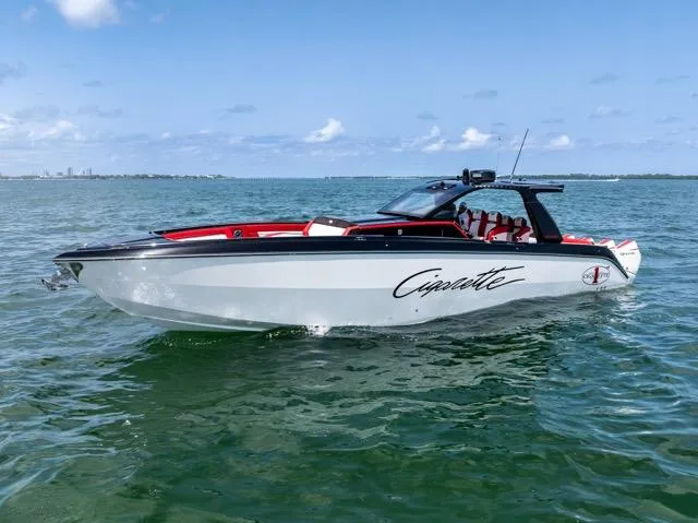  Yacht Photos Pics 2025 Cigarette 42 Auroris boat on open water, sleek design, clear sky background.