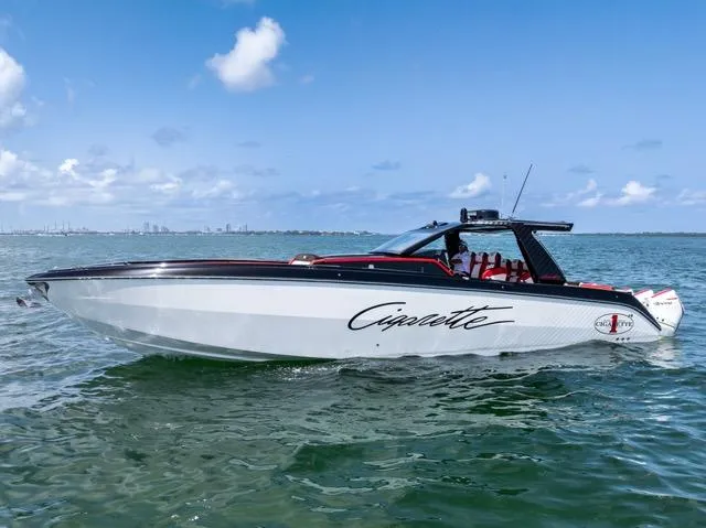  Yacht Photos Pics 2025 Cigarette 42 Auroris speedboat on water, sleek design, clear sky background.