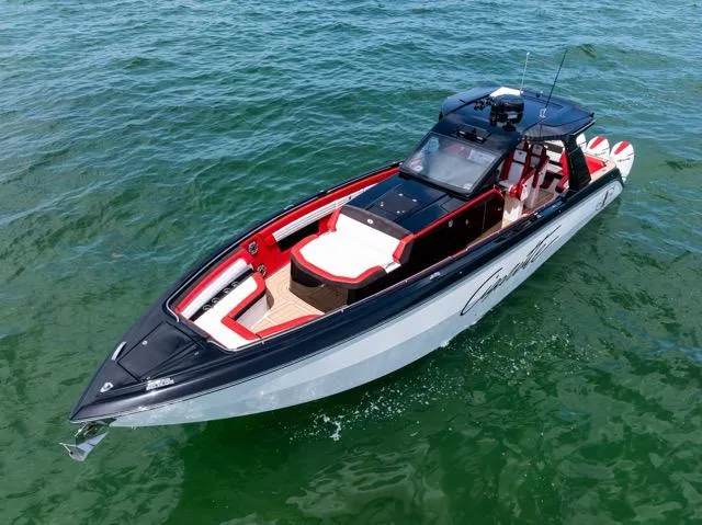  Yacht Photos Pics 2025 Cigarette 42 Auroris boat on water, sleek design, black and red accents.