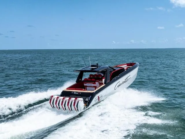  Yacht Photos Pics 2025 Cigarette 42 Auroris speedboat cruising on open water under clear skies.