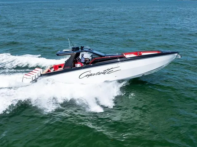  Yacht Photos Pics 2025 Cigarette 42 Auroris speedboat cruising on open water.