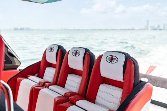  Yacht Photos Pics Red and white seats on 2025 Cigarette 42 Auroris boat, ocean view in background.