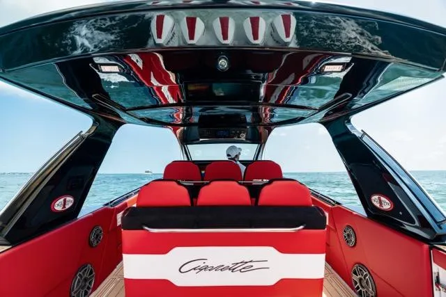  Yacht Photos Pics 2025 Cigarette 42 Auroris luxury boat interior with red seating and sleek design on open water.