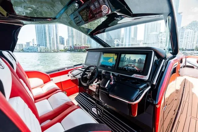  Yacht Photos Pics Interior of 2025 Cigarette 42 Auroris boat with modern dashboard and city skyline view.