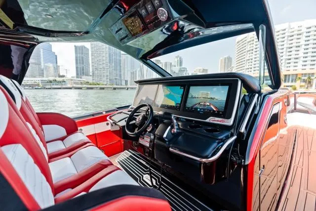  Yacht Photos Pics Interior of 2025 Cigarette 42 Auroris boat with modern dashboard and city skyline view.