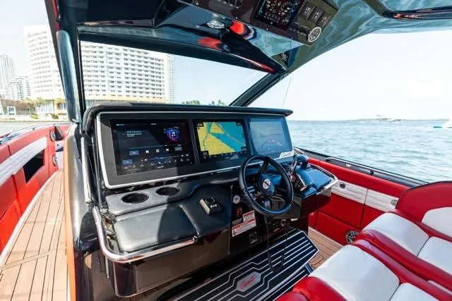  Yacht Photos Pics Interior of 2025 Cigarette 42 Auroris boat with advanced navigation system and luxurious seating.