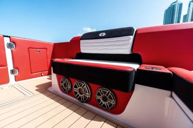  Yacht Photos Pics 2025 Cigarette 42 Auroris boat interior with red and black seating, featuring built-in speakers.