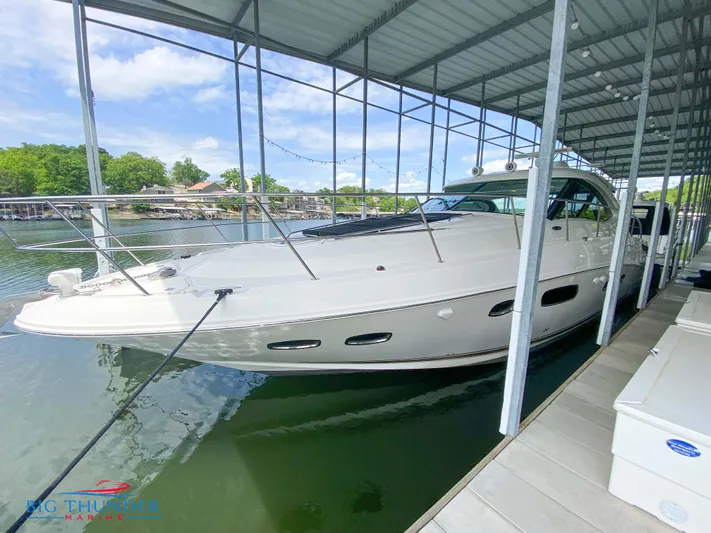  Yacht Photos Pics 2010 Sea Ray 470 Sundancer yacht docked under a covered marina.