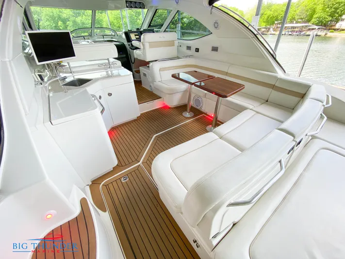  Yacht Photos Pics 2010 Sea Ray 470 Sundancer yacht interior with white seating and wood flooring.