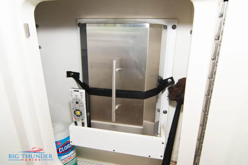  Yacht Photos Pics Storage compartment on a 2010 Sea Ray 470 Sundancer yacht with cleaning supplies.