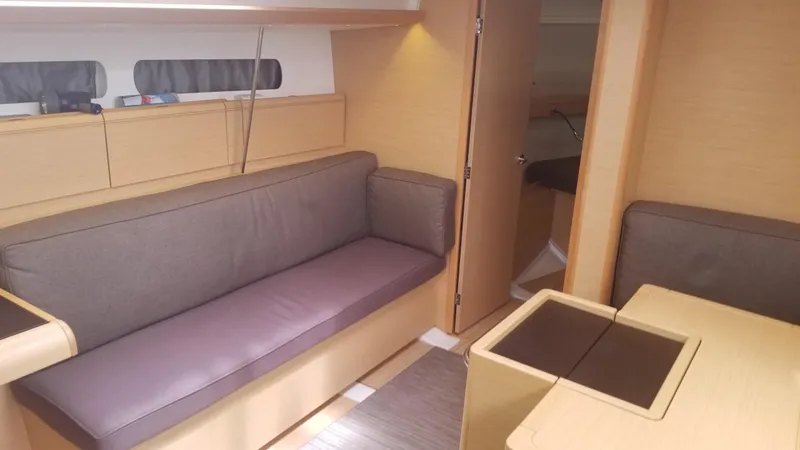  Yacht Photos Pics Interior of 2016 Jeanneau Sun Odyssey 419 yacht with cozy seating and modern design.