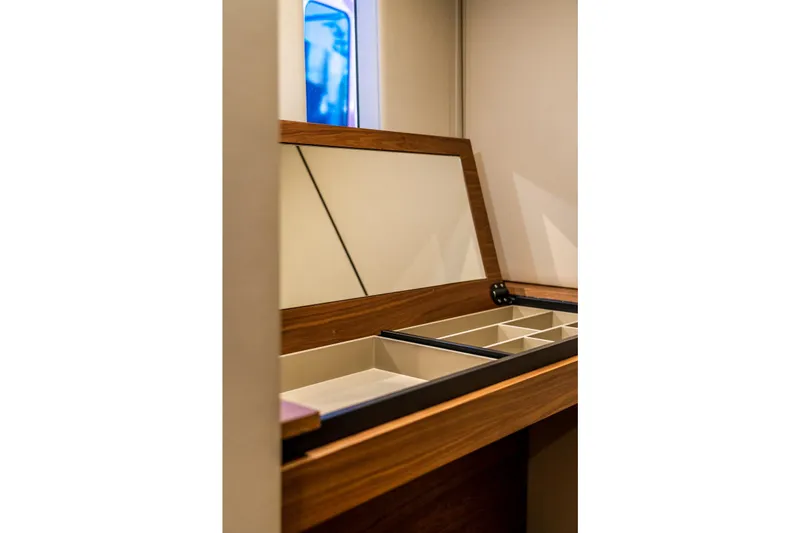 Surf Soul Yacht Photos Pics Interior storage compartment on 2023 Sunreef 50 yacht, featuring elegant wood finish and organized sections.