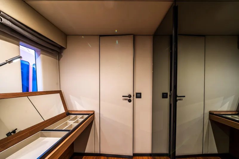 Surf Soul Yacht Photos Pics Luxurious interior of 2023 Sunreef 50 yacht with elegant wood and mirror accents.