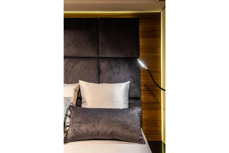 Surf Soul Yacht Photos Pics Luxurious bedroom interior on 2023 Sunreef 50 yacht with elegant lighting and plush bedding.