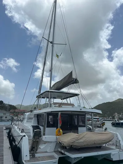 Voyager Yacht Photos Pics Sailing catamaran Bali 5.4, 2023 model, docked at marina under cloudy sky.