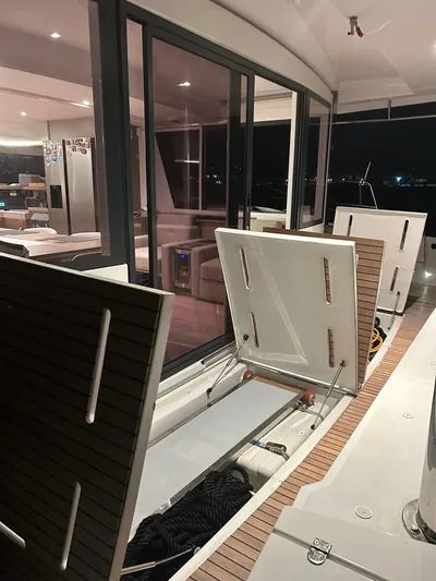 Voyager Yacht Photos Pics Luxury Bali 5.4 yacht interior with open storage compartments, modern design, 2023 model.