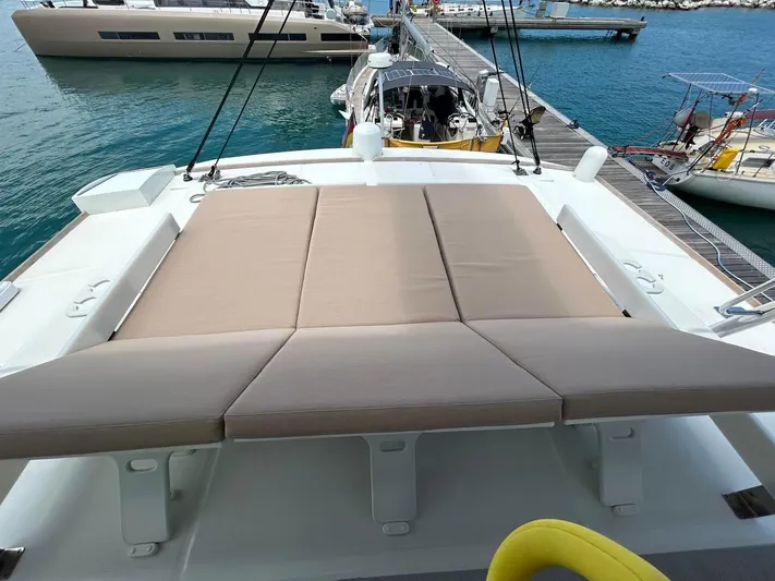 Voyager Yacht Photos Pics Luxurious Bali 5.4 yacht deck with sunbed, docked at marina, 2023 model.
