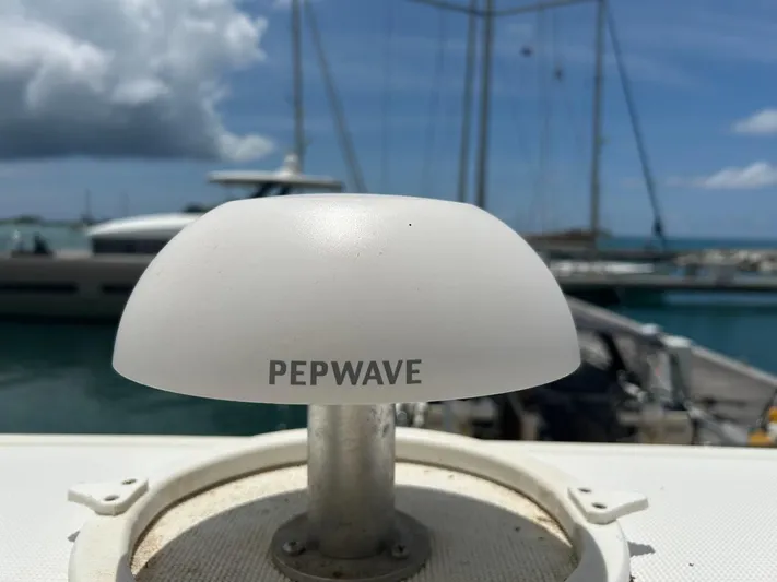 Voyager Yacht Photos Pics Pepwave antenna on Bali 5.4 yacht, 2023, with marina background.