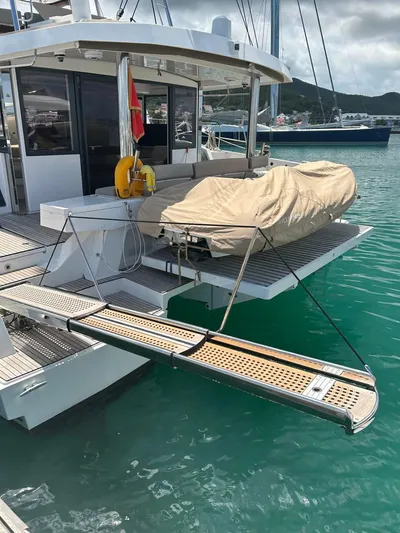 Voyager Yacht Photos Pics 2023 Bali 5.4 yacht with covered dinghy and boarding ramp in marina.