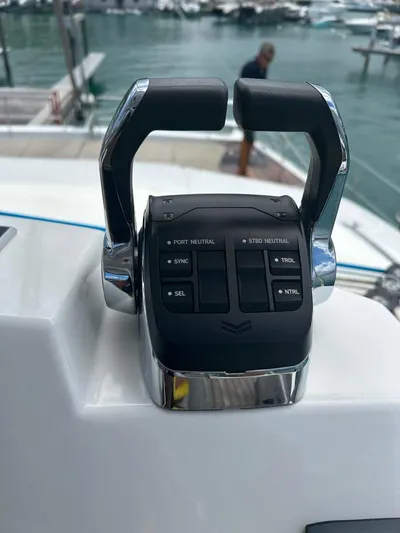 Voyager Yacht Photos Pics Boat throttle controls on a 2023 Bali 5.4, docked at a marina.