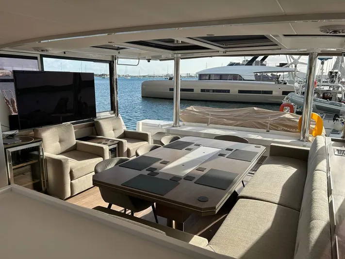 Voyager Yacht Photos Pics Luxurious interior of 2023 Bali 5.4 yacht with elegant seating and ocean view.